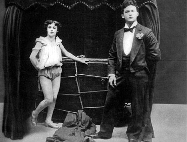 The Houdinis posing with the Metamorphosis trunk, 1894
